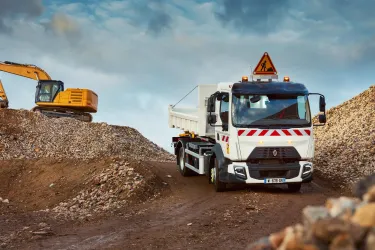 A 12-tonne / 14-tonne Renault Trucks D fitted with a Hiab crane at a sand and gravel quarry